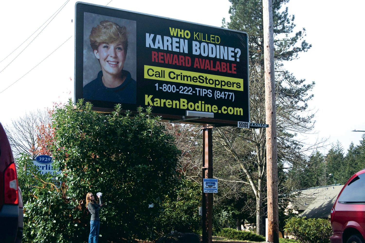 A billboard in Olympia on Martin Way East near Dirty Dave’s Pizza Parlor included a photo of Karen Bodine in this 2020 file photo.